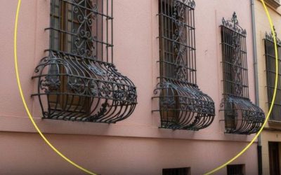 Why are some window bars curved at the bottom